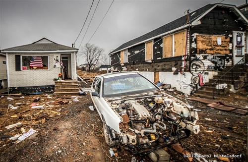 Taurozzi’s work truck was towed away from where it was parked legally next to this car. It was parked on his property in front of his home at 569 Quincy Ave. The truck was purchased after the storm, had valid NY plates, was inspected & registered.

The house to the left belongs to Taurozzi’s neighbor, James Rossi, who passed away in the storm.